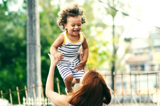 mother playing with toddler