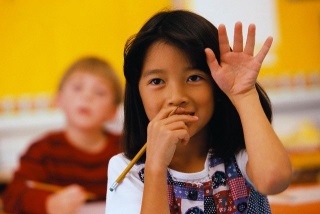 child raising hand